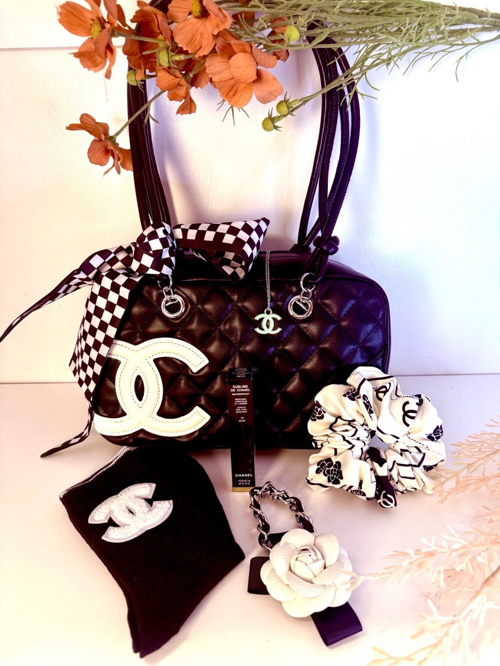 Quilted Black Shoulder Bag with White Logo Accent